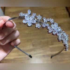 Silver formal headband with crystal flowers.